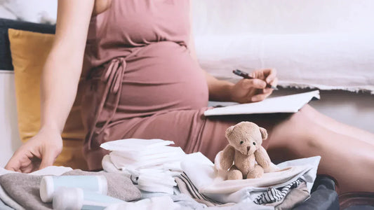Pregnant woman packing hospital bag