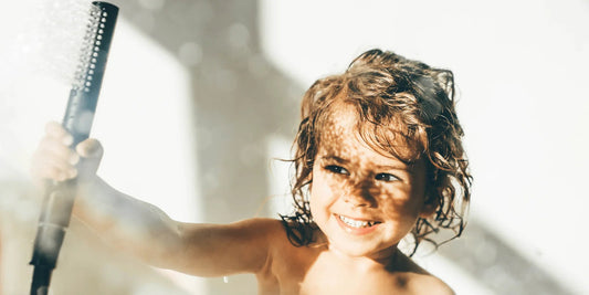 kid showering and sunlight