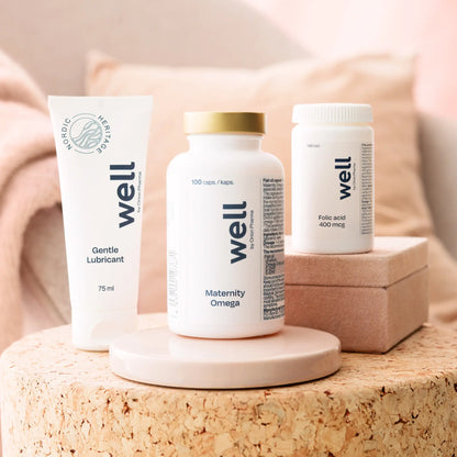 Three 'well' branded products on a cork surface with a soft, blurred background.