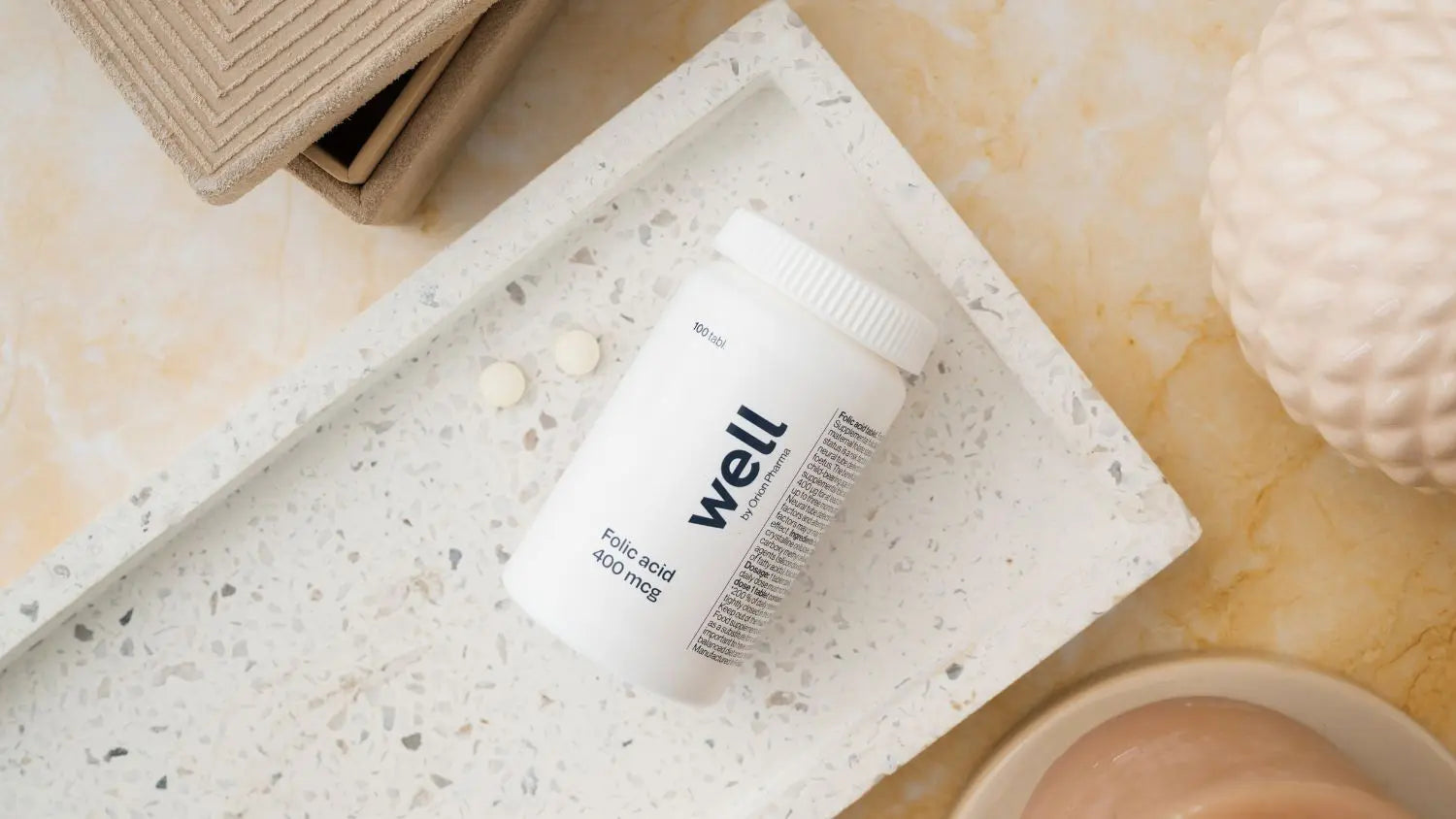 White container labeled Well by Orion Pharma on a textured surface with a neutral background